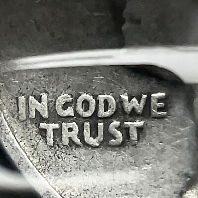 1935 Washington quarter DDO FS-101 doubled die obverse showing doubling on IN GOD WE TRUST motto under magnification